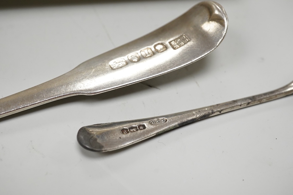 A George V silver octagonal sugar caster, Viners Ltd, Sheffield, 1932, 18.2cm, an Edwardian silver three piece condiment set by John Round, a silver napkin ring and three silver spoons including a dessert spoon by Peter,